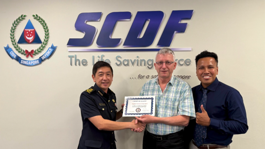 Teong How Hwa (SCDF Deputy Commissioner for Strategy &amp; Corporate Services) - left, Dr. Peter Wagner (Chair, Center for Fire Statistics of CTIF) -middle, and Noor Azam Kasiri (Senior Assistant Director for Operations Readiness in the Operations Department of SCDF) – right.