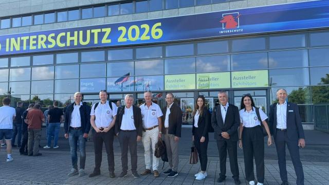 The CTIF Executive Committee at the entrance of the Interschutz fair in Hanover. 